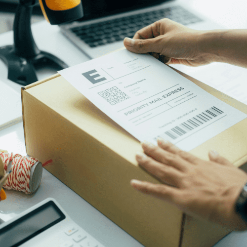 Shipping label being placed on a box