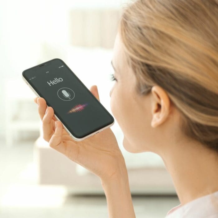 a woman using voice search on her phone
