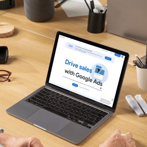 Macbook on desk with google ads