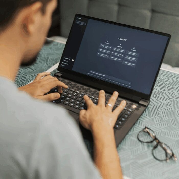 geo / man using laptop searching on chatgpt ai